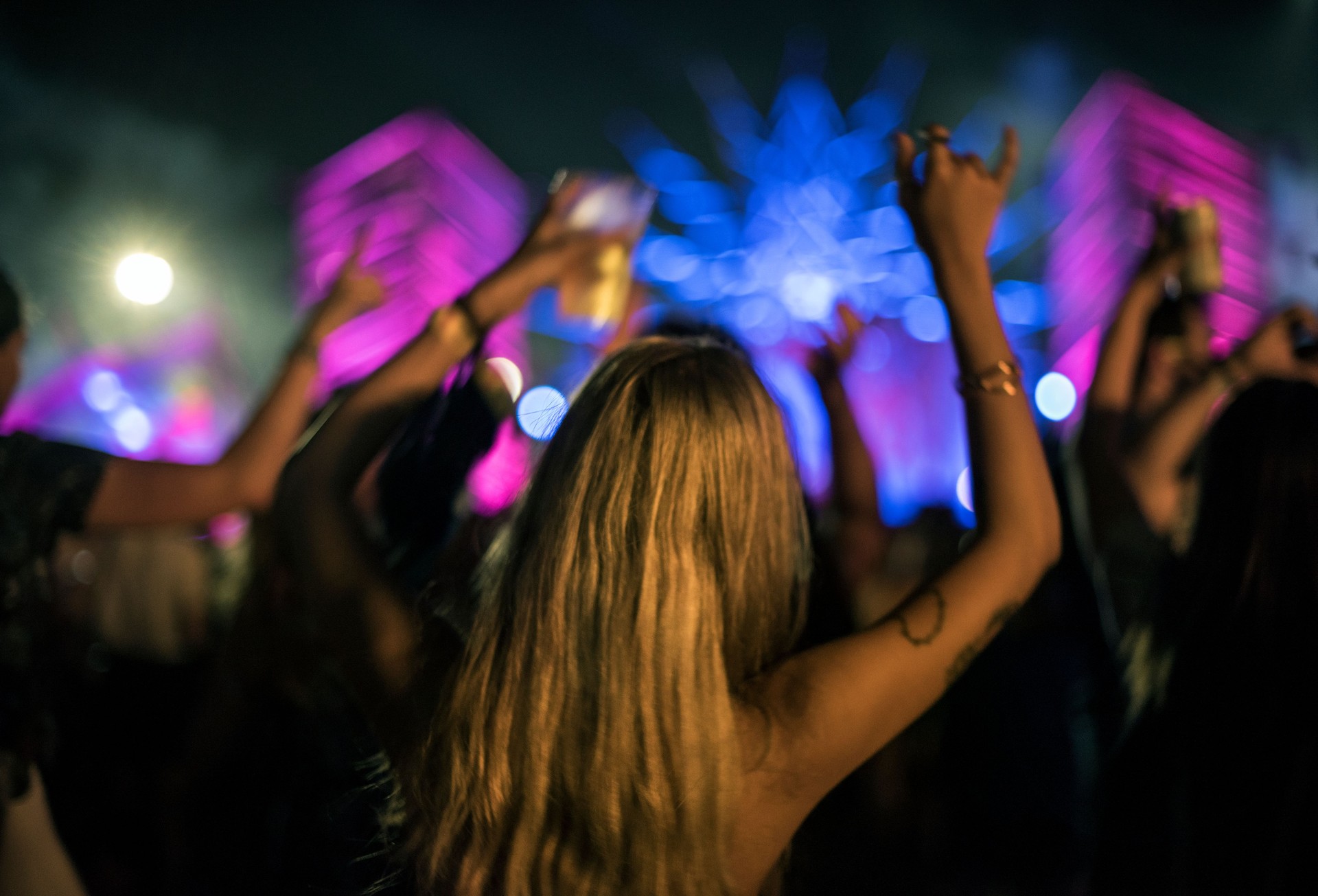 Woman with Beers Enjoying Music Festival
